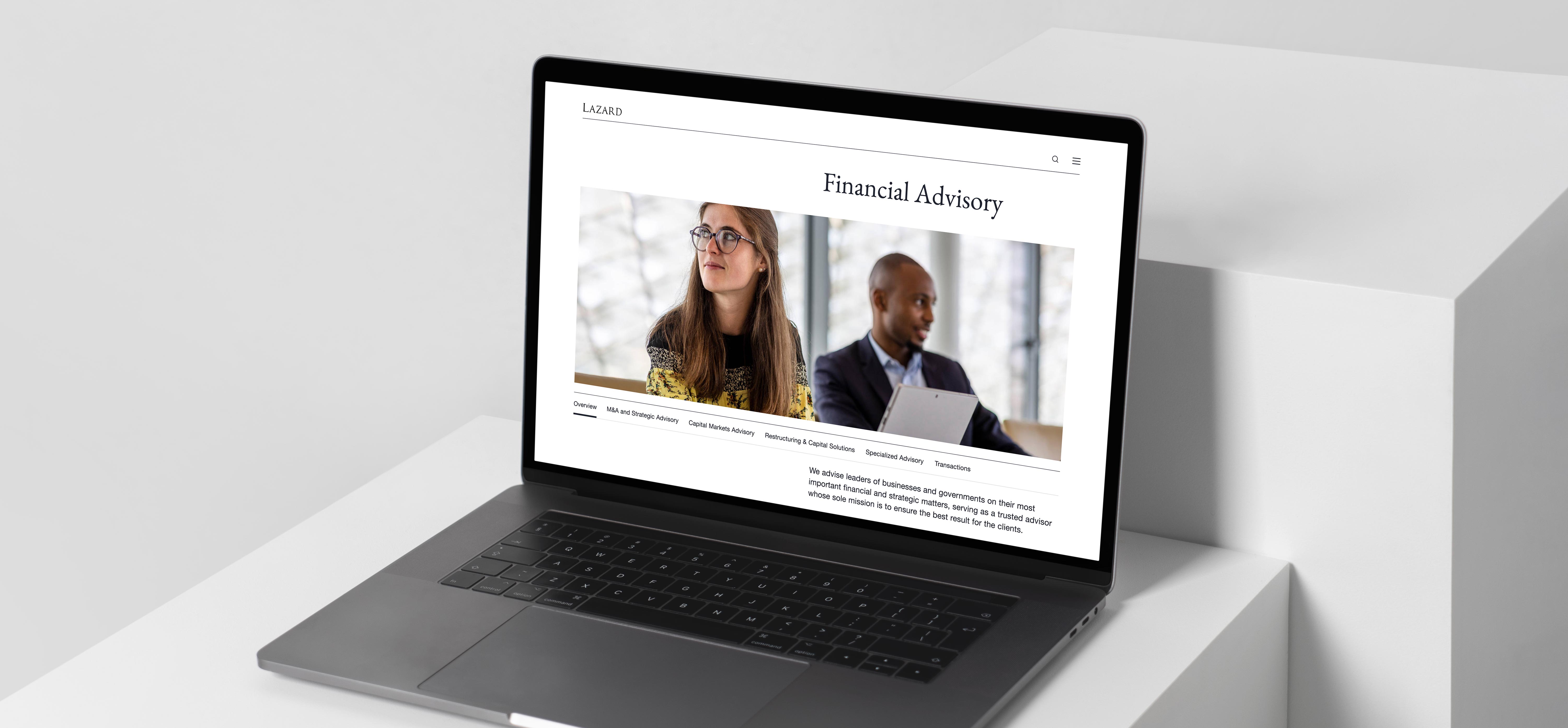 Laptop with Lazard website against minimal background